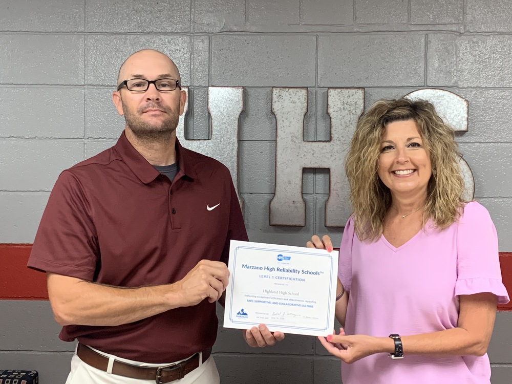 High School Principal Jeremy Lewis and Asst. Principal Missy Floyd are pictured with the certificate.